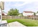 Fenced backyard featuring a well-maintained lawn and concrete patio, perfect for outdoor entertaining at 7546 Kidwell Dr, Indianapolis, IN 46239