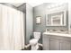 Stylish bathroom featuring gray walls, modern fixtures, and a shower with tub at 7546 Kidwell Dr, Indianapolis, IN 46239