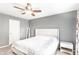Bright bedroom boasts a ceiling fan, plush carpet, and neutral color palette at 7546 Kidwell Dr, Indianapolis, IN 46239