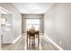 Bright dining area with a wooden table, chairs, and natural lighting at 7546 Kidwell Dr, Indianapolis, IN 46239