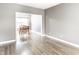 Bright dining room with wood floors, a table with four chairs, and natural light at 7546 Kidwell Dr, Indianapolis, IN 46239