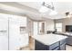 Bright kitchen with white cabinets, modern appliances, and a contrasting kitchen island at 7546 Kidwell Dr, Indianapolis, IN 46239