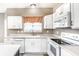 Bright kitchen with white cabinets and modern appliances at 7546 Kidwell Dr, Indianapolis, IN 46239