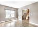 Inviting room with wood-look floors and stairs leading to the upper level at 7546 Kidwell Dr, Indianapolis, IN 46239