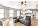Cozy living room flows into a modern kitchen with white cabinets and stainless steel appliances at 7546 Kidwell Dr, Indianapolis, IN 46239