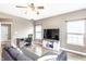 Comfortable living room with modern furnishings and a view to an adjacent office space at 7546 Kidwell Dr, Indianapolis, IN 46239