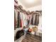 Spacious walk-in closet with clothing racks, shelves and personal items for storage at 7546 Kidwell Dr, Indianapolis, IN 46239