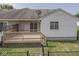 Backyard with a wooden deck and black chainlink fence at 824 Ashton Park Dr, Greenwood, IN 46143