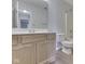 Bathroom with light-colored wood vanity, laminate floor, white toilet, and shower/tub combo at 824 Ashton Park Dr, Greenwood, IN 46143