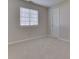 Bedroom with a window with blinds, neutral carpet, and a white door at 824 Ashton Park Dr, Greenwood, IN 46143