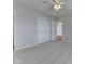 Neutral bedroom has ceiling fan, plush carpet, and ample closet space at 824 Ashton Park Dr, Greenwood, IN 46143