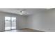 Bright bedroom featuring hardwood floors, a ceiling fan, and sliding glass doors to deck at 824 Ashton Park Dr, Greenwood, IN 46143