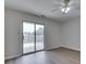 Inviting bedroom features sliding glass doors opening to a deck and updated flooring at 824 Ashton Park Dr, Greenwood, IN 46143