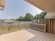 Wooden deck with rail overlooking the backyard and fence offers a nice outdoor space at 824 Ashton Park Dr, Greenwood, IN 46143