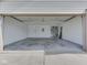 Spacious two car garage with white walls and concrete floors at 824 Ashton Park Dr, Greenwood, IN 46143