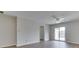 Bright living room features wood-look floors and sliding door access to a private deck at 824 Ashton Park Dr, Greenwood, IN 46143