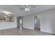 Open-concept living space with hardwood floors and access to kitchen and hallway at 824 Ashton Park Dr, Greenwood, IN 46143
