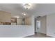 Open-concept living space with hardwood floors leading to kitchen and hallways at 824 Ashton Park Dr, Greenwood, IN 46143