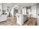 Modern kitchen with a large island, stainless steel appliances, and a cozy breakfast bar at 8635 Verbena Rd, Zionsville, IN 46077
