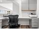 Built-in office with a spacious desk, printer, and plenty of cabinet storage at 8635 Verbena Rd, Zionsville, IN 46077