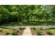 Beautiful wooded lot with graveled path is viewed from the stairs at 8717 Moore Rd, Indianapolis, IN 46278