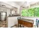 Sunny kitchen with views of the beautiful greenery outside at 8717 Moore Rd, Indianapolis, IN 46278
