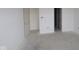 Bright bedroom with an unfinished floor and white doors at 10132 Redwood Peak Ln, Indianapolis, IN 46259