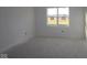 An unfinished bedroom with a large window, and neutral paint at 10132 Redwood Peak Ln, Indianapolis, IN 46259