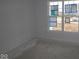 Bright, empty bedroom with a large window, ready for your personal touch and design at 10132 Redwood Peak Ln, Indianapolis, IN 46259