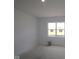 This bedroom features natural light through a large window, ideal for creating a personal retreat at 10132 Redwood Peak Ln, Indianapolis, IN 46259