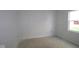 An unfinished bedroom with a large window, and neutral paint at 10132 Redwood Peak Ln, Indianapolis, IN 46259