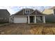 Charming new construction home featuring a covered porch and an attached two-car garage at 10132 Redwood Peak Ln, Indianapolis, IN 46259