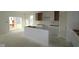 Spacious kitchen with white cabinets, a center island, and ample room for customization at 10132 Redwood Peak Ln, Indianapolis, IN 46259