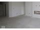 Unfinished living room featuring a fireplace, a large window, and neutral paint at 10132 Redwood Peak Ln, Indianapolis, IN 46259