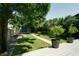 Inviting backyard featuring a well-manicured lawn, trees, and a charming walkway at 1021 N Alabama St, Indianapolis, IN 46202