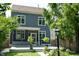 Charming backyard featuring a deck, screened porch and beautifully landscaped yard at 1021 N Alabama St, Indianapolis, IN 46202