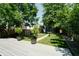 Lush backyard featuring a well-maintained lawn, a pathway, and mature trees, creating a private outdoor oasis at 1021 N Alabama St, Indianapolis, IN 46202