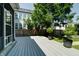 Backyard featuring a deck with views of well-maintained grass and landscaping at 1021 N Alabama St, Indianapolis, IN 46202