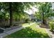 Spacious backyard with lush lawn and walkway leading to a charming house at 1021 N Alabama St, Indianapolis, IN 46202