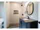 Bathroom with a glass walk-in shower, a blue vanity, and tile floors at 1021 N Alabama St, Indianapolis, IN 46202