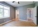 Bright bedroom with light hardwood floors, a ceiling fan, and two closets at 1021 N Alabama St, Indianapolis, IN 46202