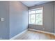 Bedroom with light hardwood floors and a large window that provides natural light at 1021 N Alabama St, Indianapolis, IN 46202