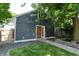 Detached garage with double doors and well-maintained landscaping at 1021 N Alabama St, Indianapolis, IN 46202