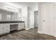 Bathroom with white cabinets, vanity, and dark-toned wood flooring at 10248 Noble Ct, Indianapolis, IN 46234