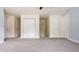 Carpeted bedroom featuring many closets and neutral paint at 10248 Noble Ct, Indianapolis, IN 46234
