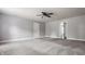 Carpeted bedroom featuring neutral walls, a ceiling fan, and a doorway at 10248 Noble Ct, Indianapolis, IN 46234