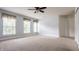 Spacious bedroom featuring three windows letting in natural light, and neutral carpet at 10248 Noble Ct, Indianapolis, IN 46234
