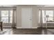 Bright entryway with hardwood floors, neutral walls, and natural light from the windows at 10248 Noble Ct, Indianapolis, IN 46234