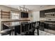 Well-lit kitchen showcases black cabinets, stainless steel appliances, and a large island with seating at 10248 Noble Ct, Indianapolis, IN 46234