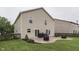 Spacious backyard with a patio, lush lawn, and a well-maintained wooden fence at 10510 Mcclain Dr, Brownsburg, IN 46112